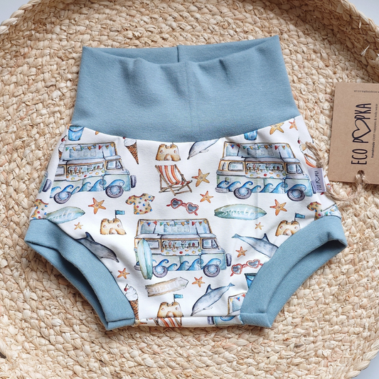 Eco Poopka handmade baby bummies shorts with beach holiday print, crafted from soft cotton blend fabric, designed to fit over cloth nappies.
