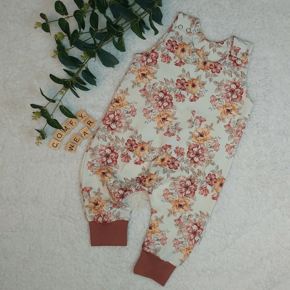 Baby romper with clay pink and light orange flowers